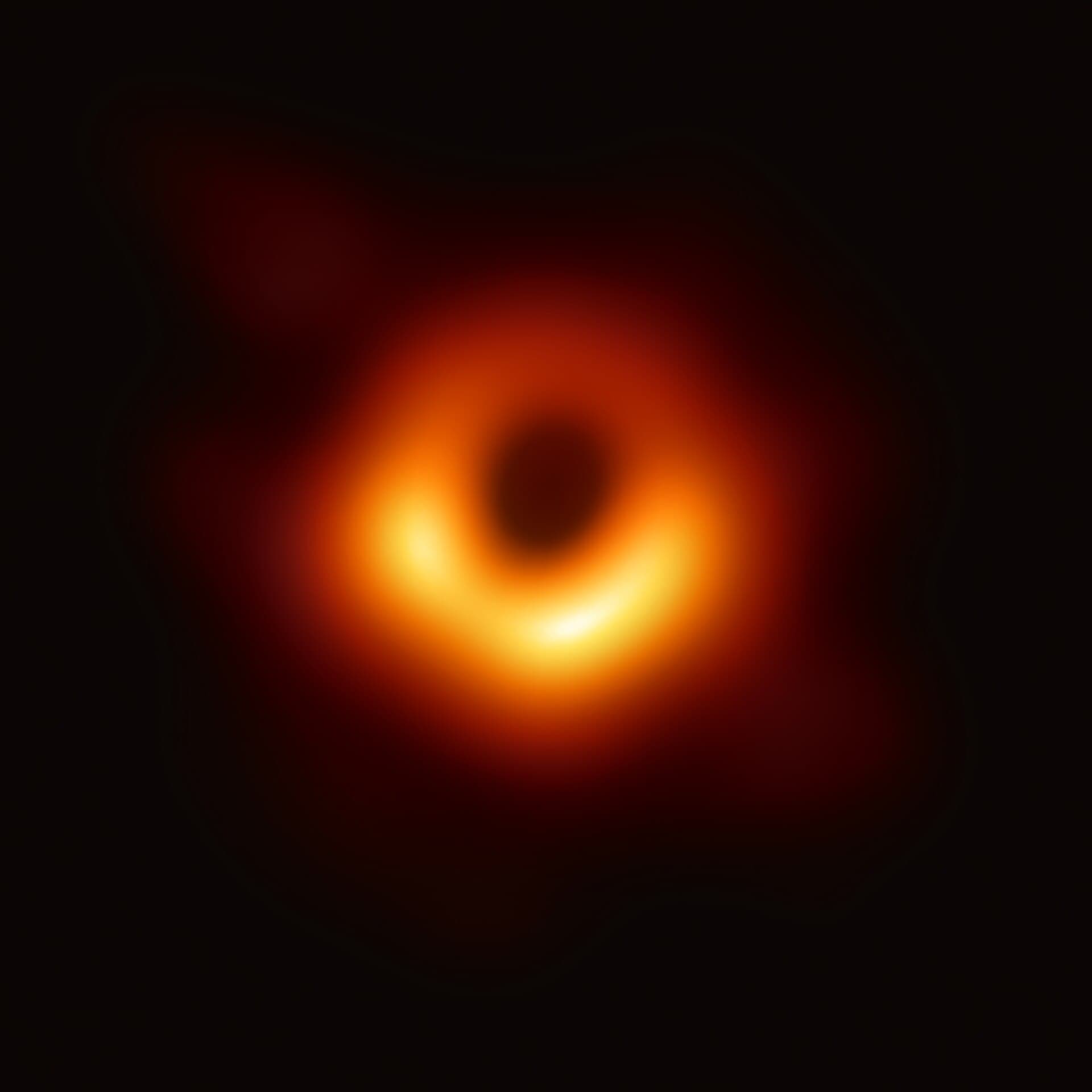 The first image of a black hole: a glowing orange ring around a dark centre in galaxy Messier 87