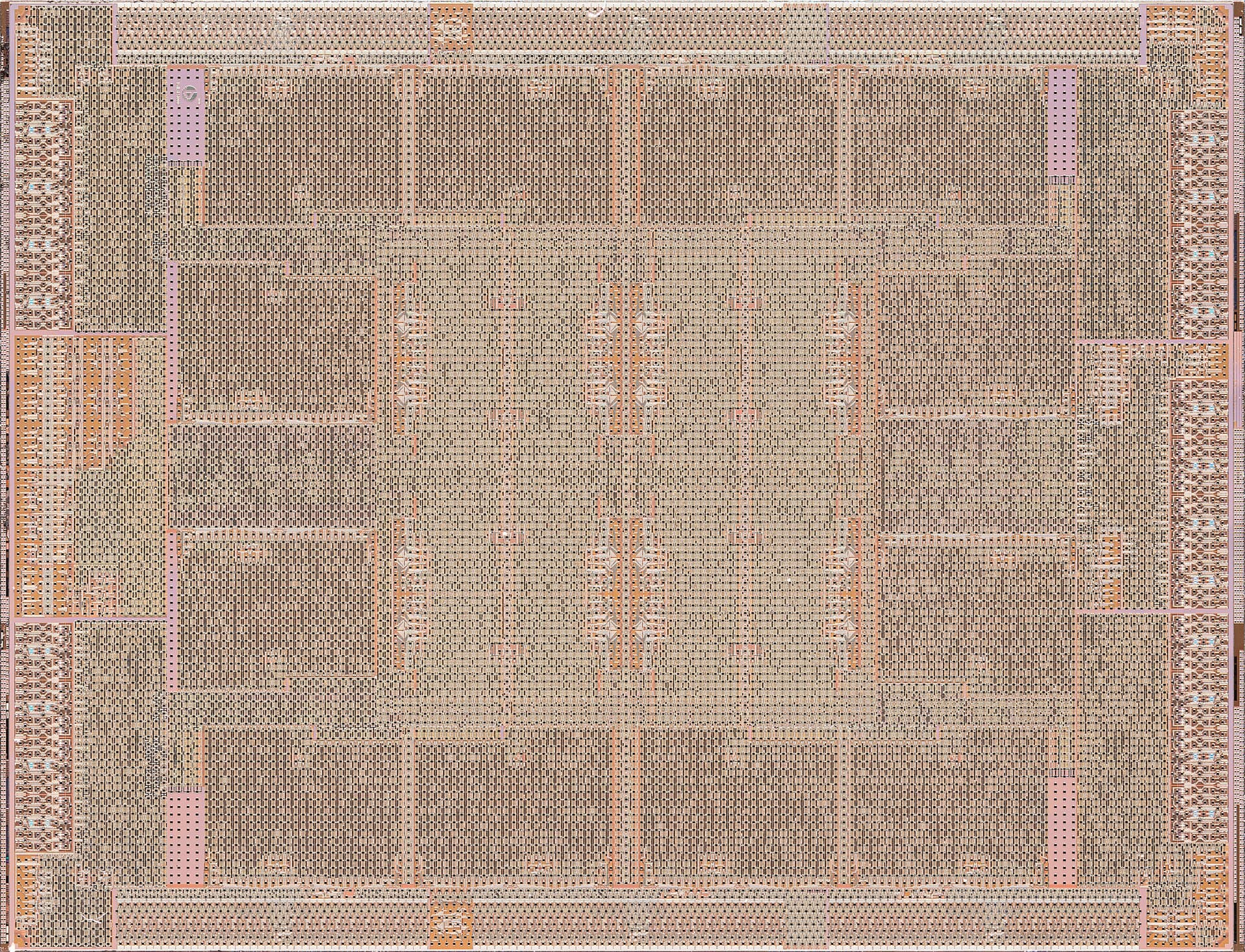 Macro photograph of a processor die showing intricate metallic circuit patterns